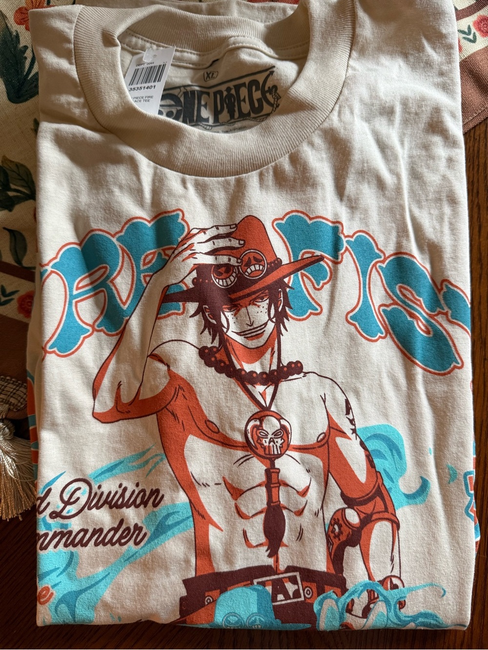 Onepiece Cream Graphic Tee with Teal & Orange Print